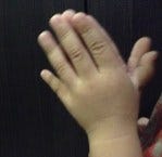 praying hands of a child