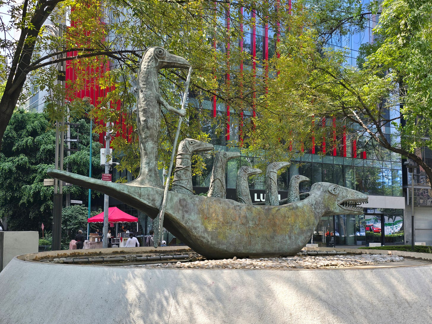 The Cocodrilo bronze crocodile sculpture by Leonora Carrington on a Mexico City sidewalk