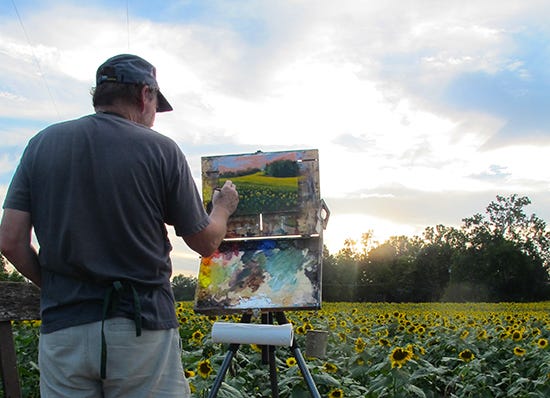 photo of John Hulsey painting sunflowers