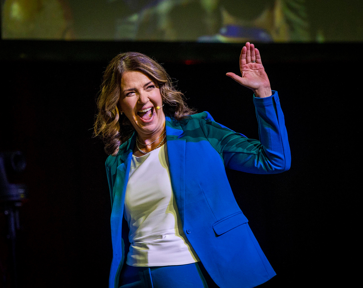 Danielle Smith waves to a crowd