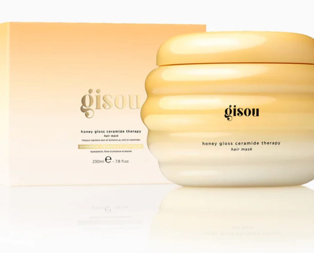 An image of the pot and box of the Gisou Honey Gloss hair mask for The Beauty Ed® substack
