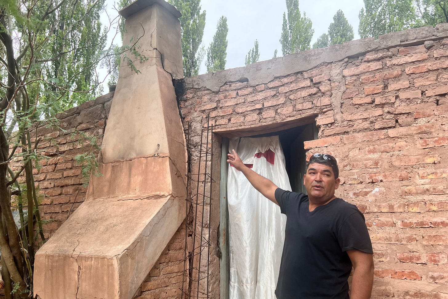 Andres Duran, a Sauzal Bonito resident, points to a crack in his chimney that he says was caused by fracking-induced earthquakes. Andres Duran, a Sauzal Bonito resident, points to a crack in his chimney that he says was caused by fracking-induced earthquakes.
