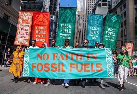 Six photos showing closeups of marchers with various banners and signs