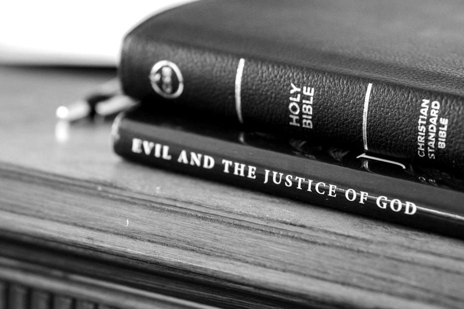 four books on brown wooden table