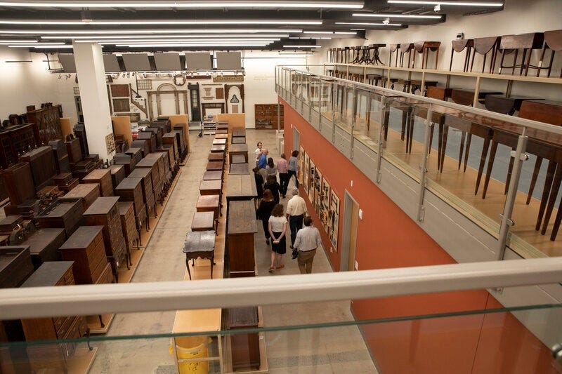 Visitors on a tour of the furniture study.