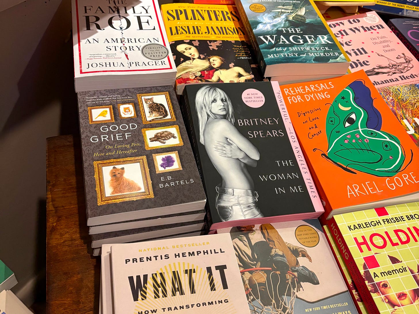 Piles of paperback books on a table. Piles of paperback books on a table.