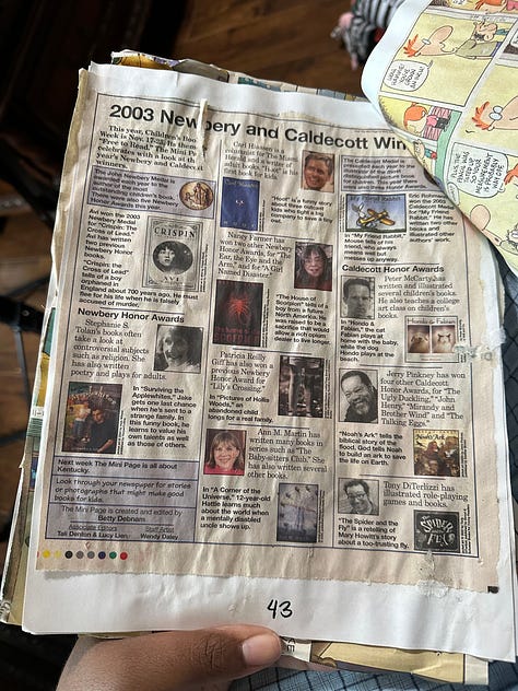 Comic strips from the Sunday paper cut out and glued to pieces of printer paper and then held together by binder clips. The front cover is a manila piece of cardstock with colorful lettering: "Comics of all my favorite comics"