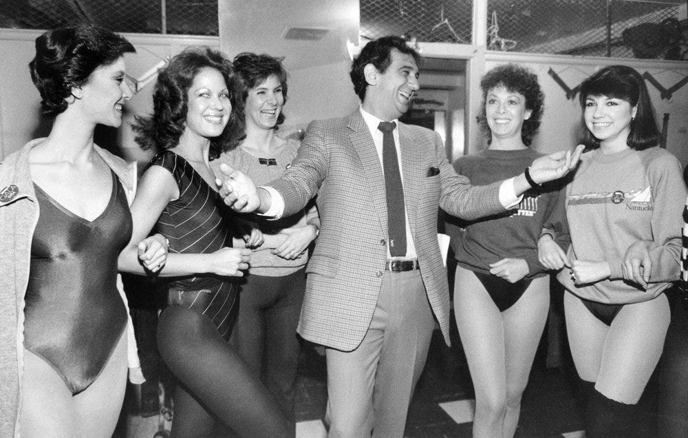 Plácido Domingo surrounded by women in leotards Plácido Domingo surrounded by women in leotards