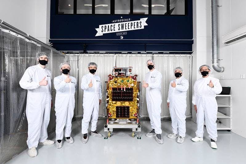 Astroscale management team posing with the Elsa-D space junk removal tool