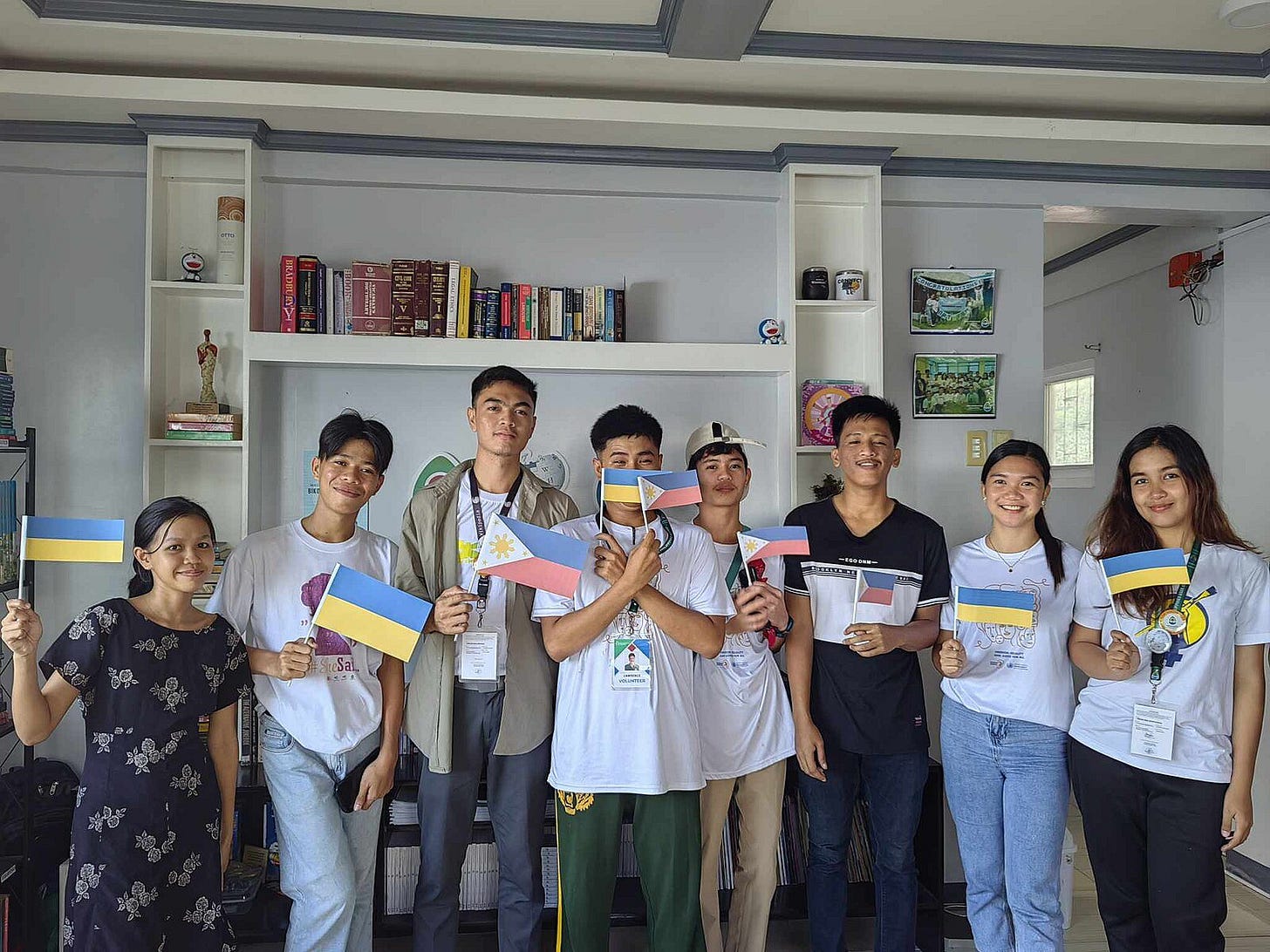 May be an image of 7 people, people studying and text