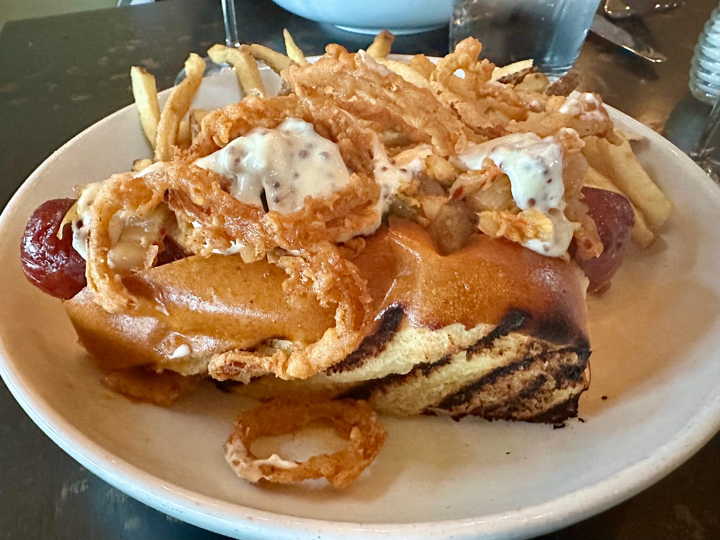 Kimchi hot dog with Black Angus beef on brioche bun served with golden fries at Beach Road Restaurant, Martha's Vineyard
