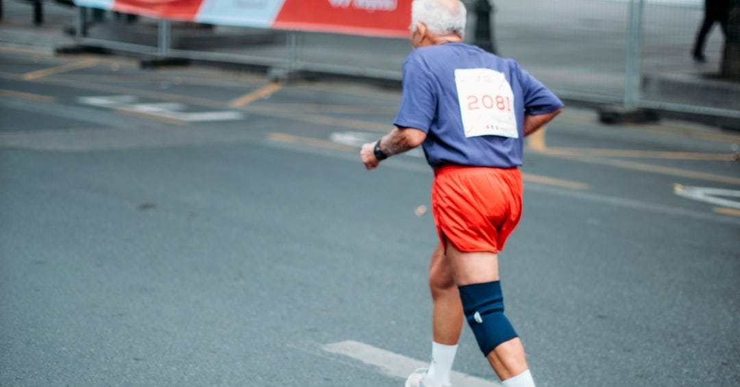 man walking on road