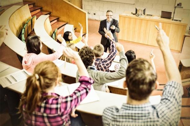 In the modern era, access to higher education and education in general has become a lot more widespread for people from different backgrounds. Pictured: modern day students studying in a lecture hall at university. (ectorfusionart / Adobe stock)