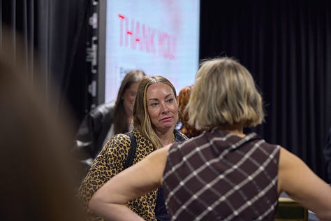 Photos of Lauren and Beth on stage at our latest Accelerator workshop, as well as photos of attendees chatting at the event.