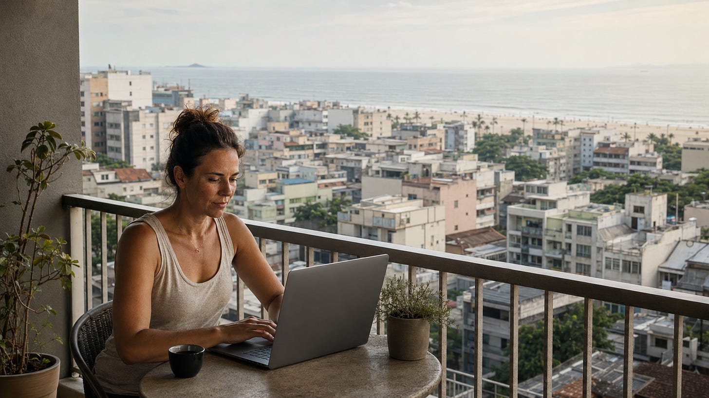 Woman in her fifties working remotely at a sunlit café table