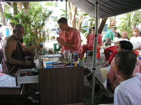 Luang Por gives Tim and the other patients silver rings