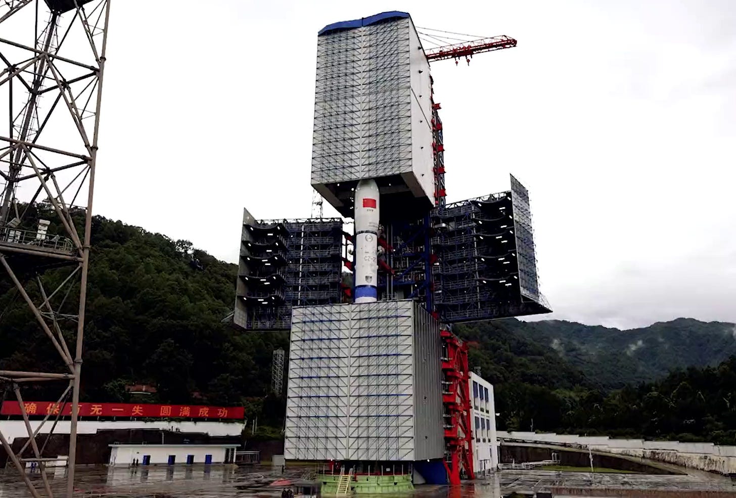 The Long March 2D Y94 vehicle emerging from Launch Complex 3’s servicing structure.