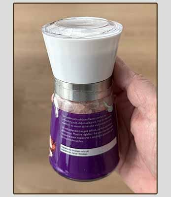 The author holding a plastic salt grinder. The grinding portion is smooth hard plastic.
