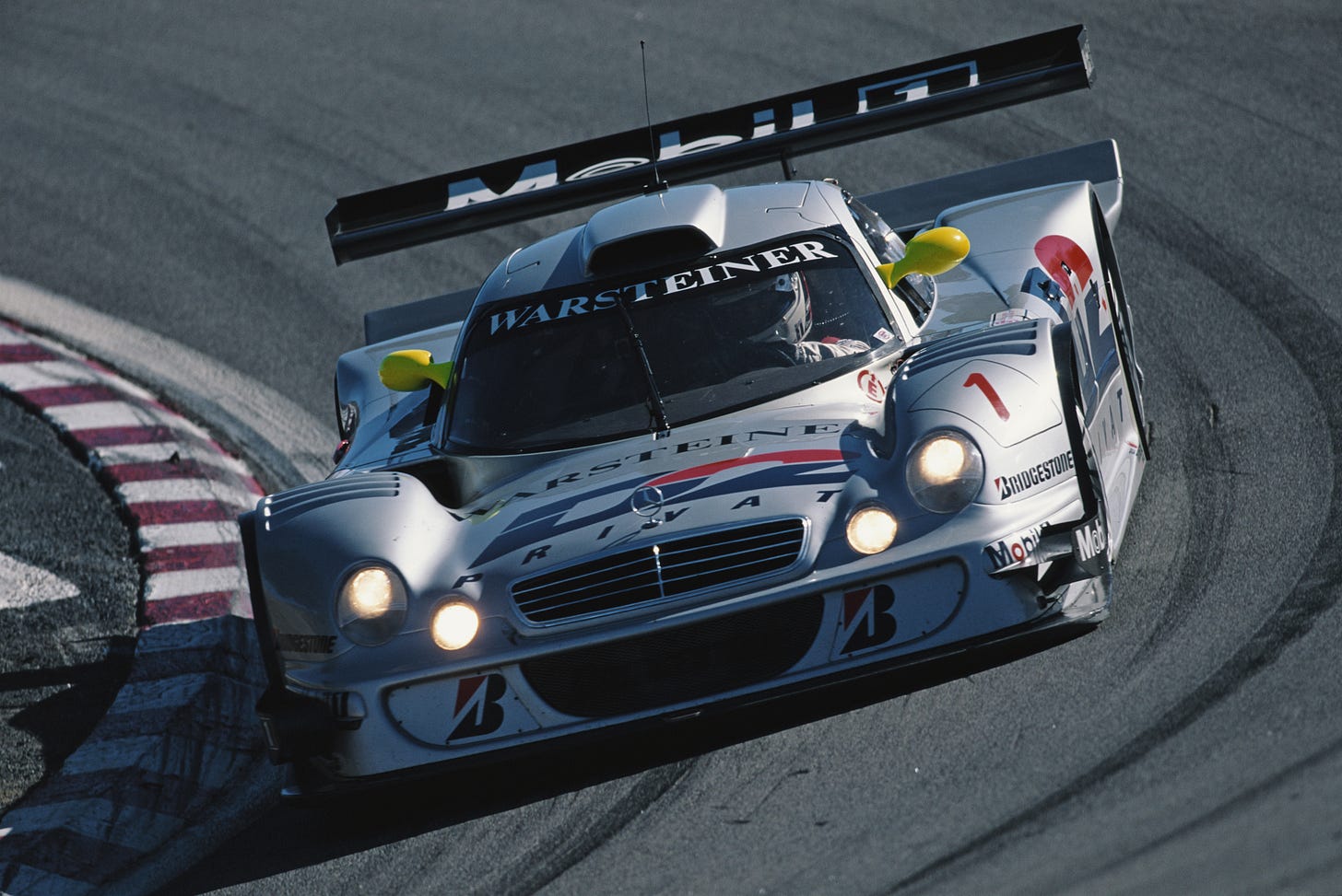 Watch A Mercedes Benz CLK GTR Powerslide and Attack A Dirt Road