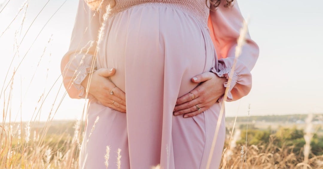 a person wearing a pink dress