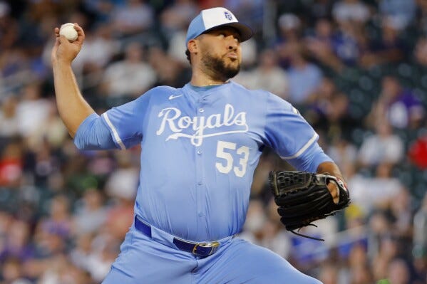 Kansas City Royals relief pitcher Carlos Estevez throws to the Minnesota Twins in the ninth inning of a baseball game Saturday, Aug. 9, 2025, in Minneapolis. (AP Photo/Bruce Kluckhohn)