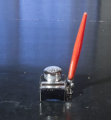 Inkwell with fountain pen