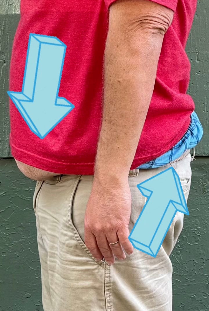 On the left, I'm pretending to ride the train. On the right, a zoom in on the spots the shirt doesn't cover me with cheesy arrows
