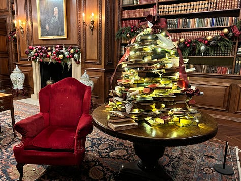 images of Christmas lights and lanterns including a tunnel of light and a tree of books