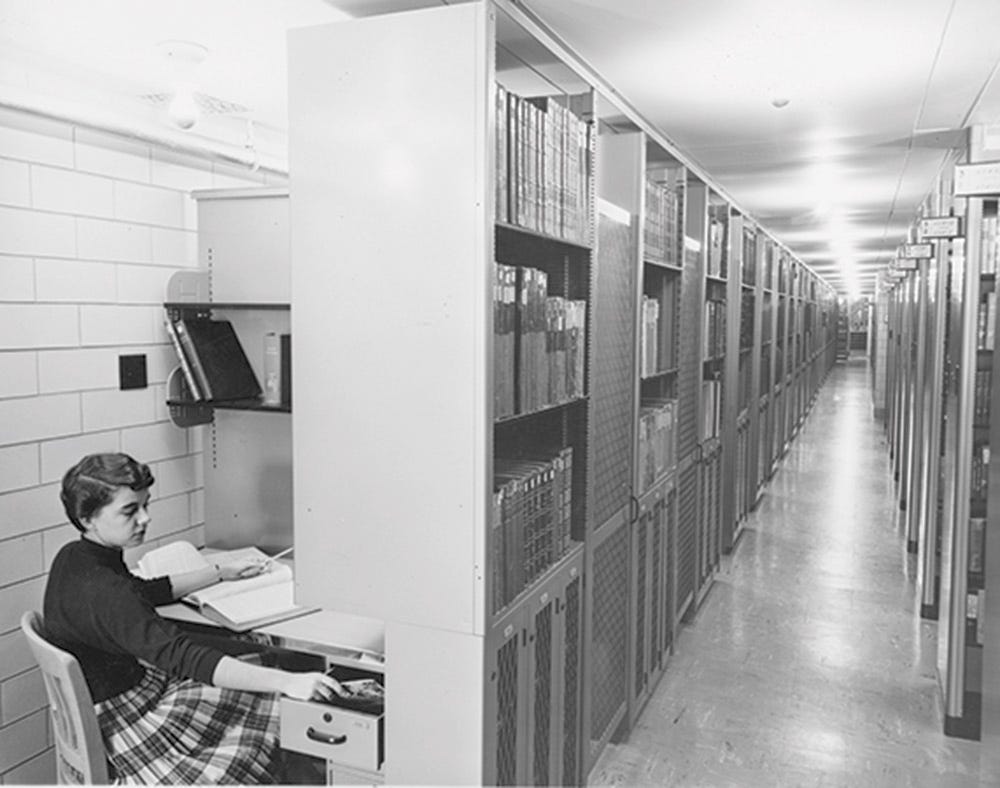Historical black-and-white image of UW Madison Memorial Library study cages