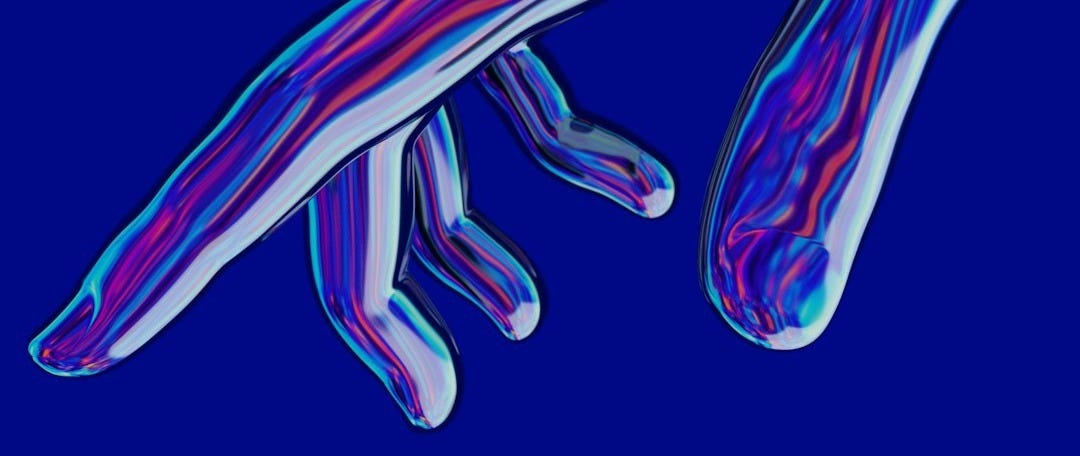 a blue and purple image of a person's hand