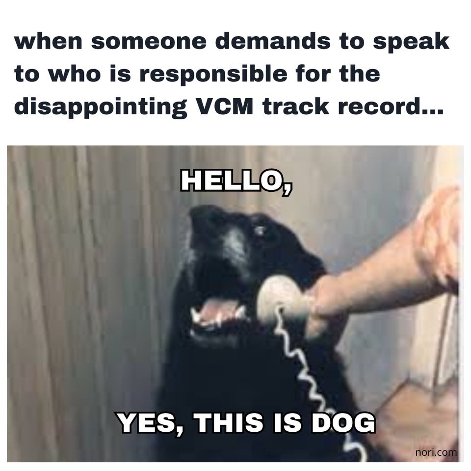 "when someone demands to speak to who is responsible for the disappointing VCM track record..." above a black dog holding a phone receiver, captioned "Hello, yes, this is dog."