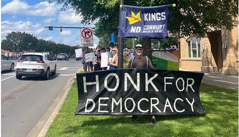 photo gallery of images from the 6/14 protest in Rock Hill showing signs and people