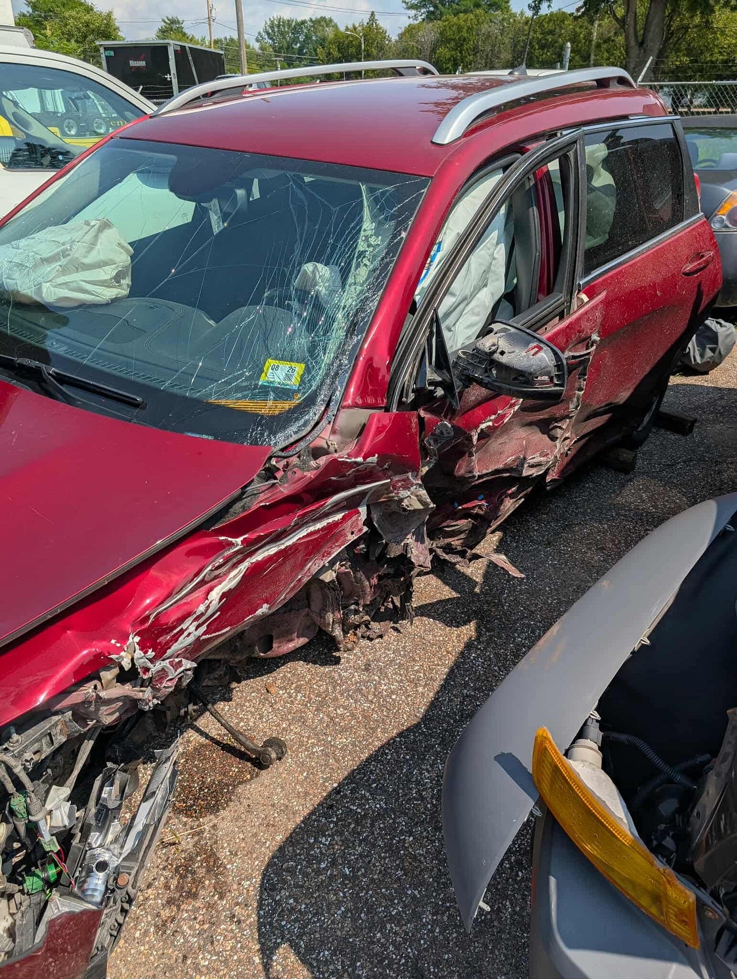 Crumpled SUV with severe damage to the driver’s side—evidence of a near-fatal accident. Crumpled SUV with severe damage to the driver’s side—evidence of a near-fatal accident.