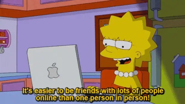 An image of Lisa Simpson sitting at an Apple Macbook saying "It's easier to be friends with lots of people online than one person in person!"