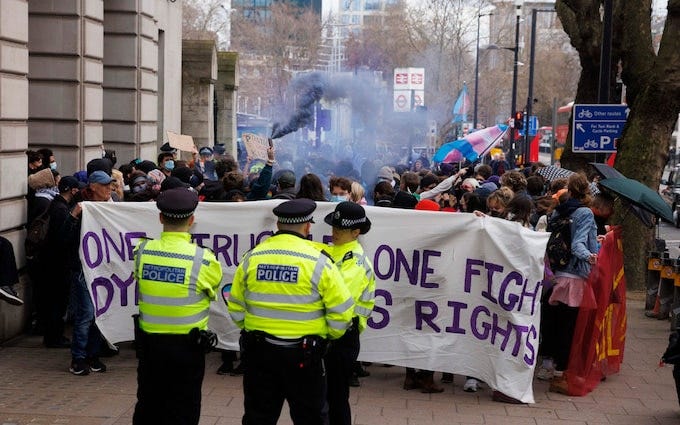 Police officers were required to prevent demonstrators gaining entrance to the conference Police officers were required to prevent demonstrators gaining entrance to the conference