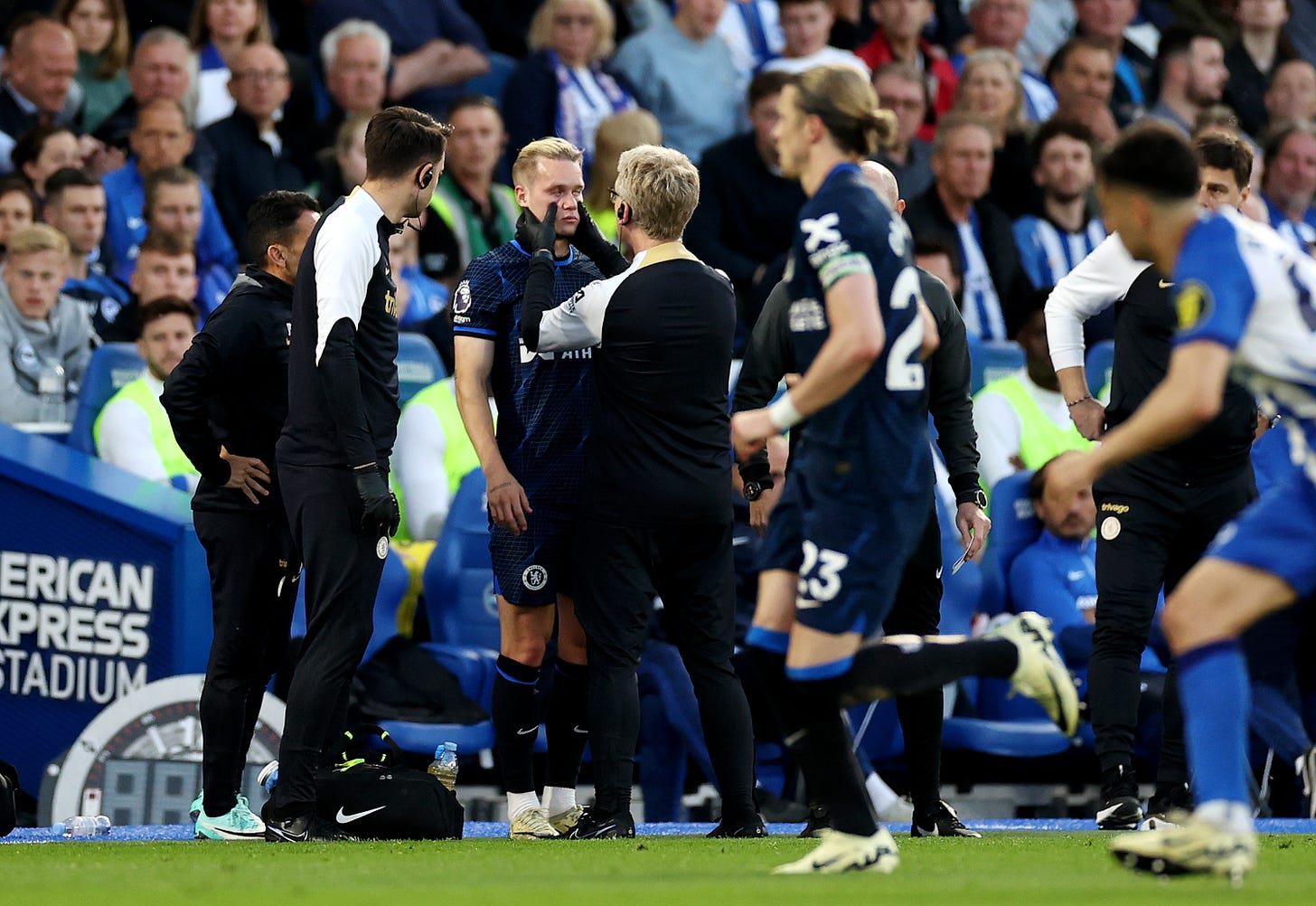 Mykhailo Mudryk pictured being checked on by medical staff during Chelsea's 2-1 win at Brighton in May 2024