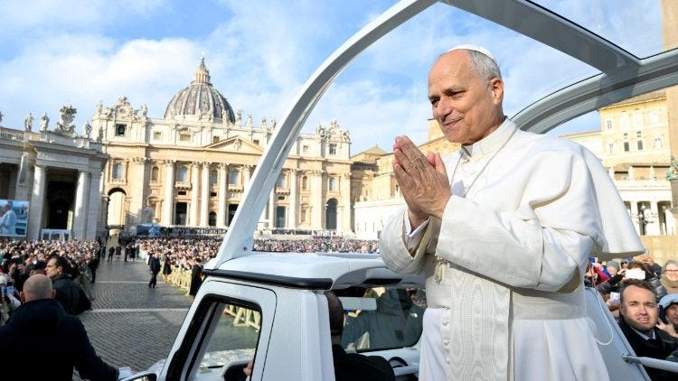 Pope Leo greets the faithful from his popemobile Pope Leo greets the faithful from his popemobile