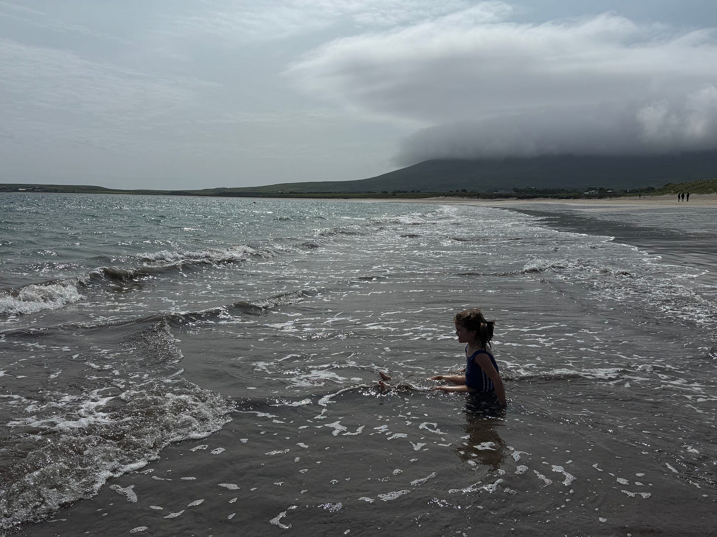Girl in cold Irish surf