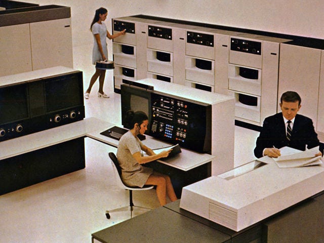 Three people working at the IBM 3330 Data Storage facility. Three people working at the IBM 3330 Data Storage facility.