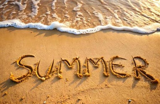 Summer written in beach sand Summer written in beach sand