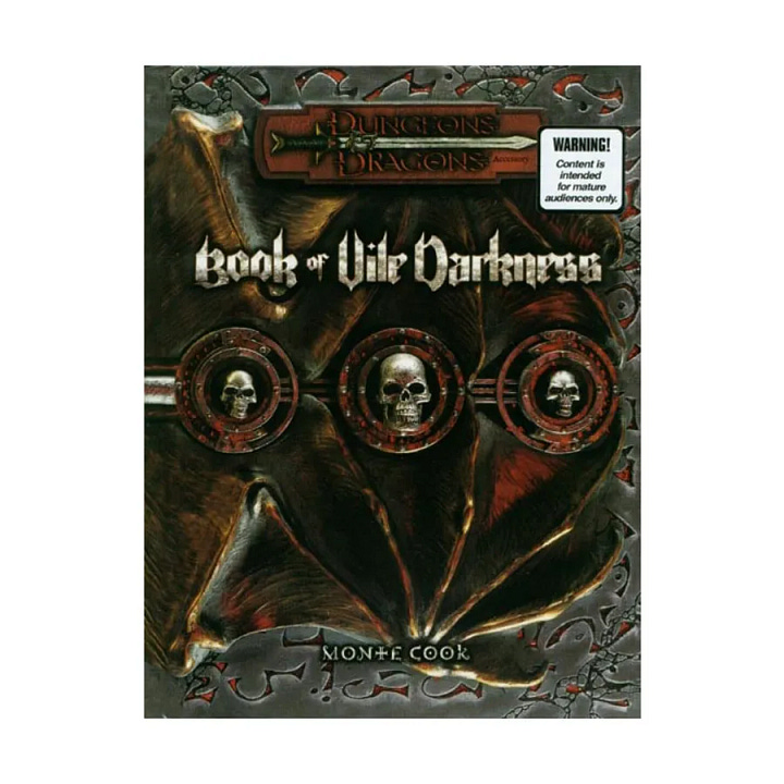 The cover of the Book of Erotic Fantasy. The cover art is a photoshopped photograph of a grey-skinned woman in a corset, on a black background. She has black eyes, grey skin, horns, and feathered wings. The book is accented with leather and gold skeuomorphic trim.