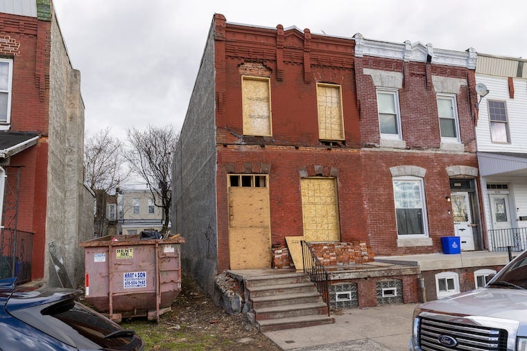Some of the rents that RAD Diversified REIT says in SEC filings that it's expecting appear to be overstated, in light of the buildings’ conditions. This boarded-up rowhouse at 4243 Leidy Ave., for example, is said to be earning the company $14,400 a year in rent — even though it has no rental license and its most recent license was as a vacant property.