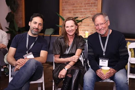 Meghan Daum hosting an Unspeakeasy retreat weekend in New York City with attendees in conversation around a table