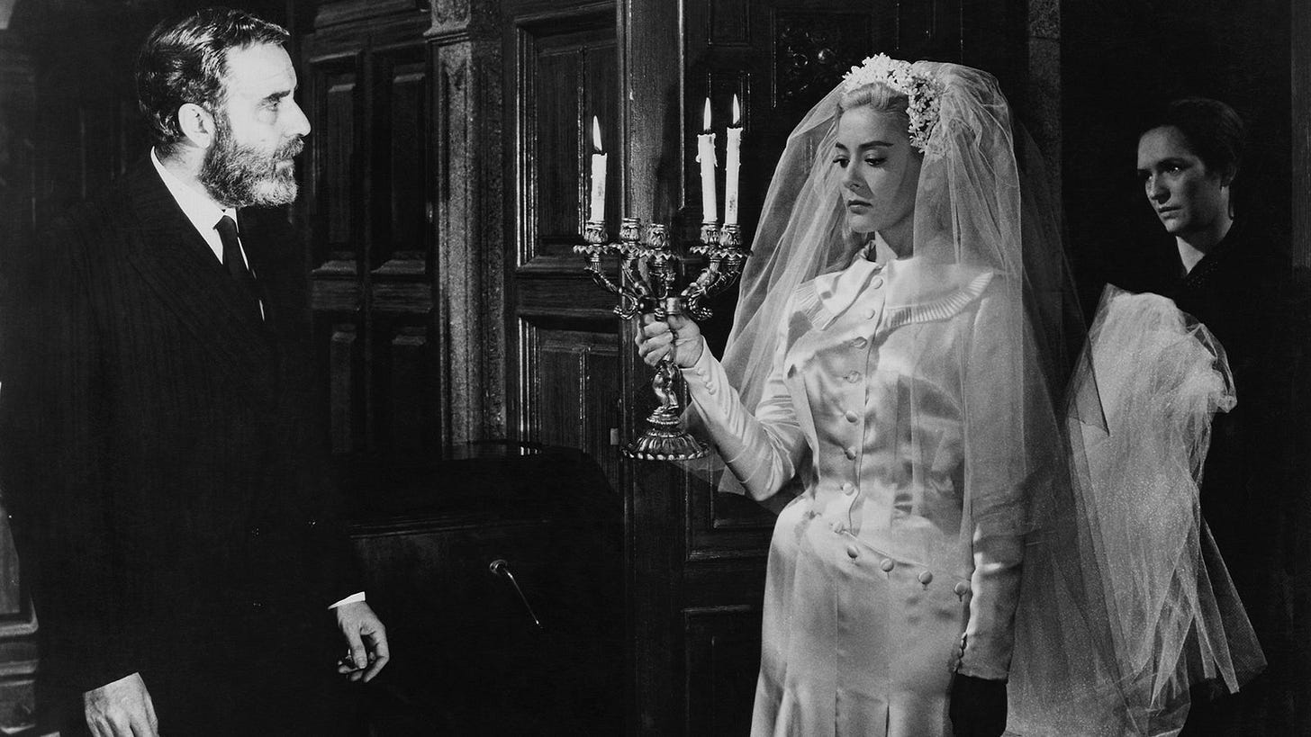 Viridiana | Still features Silvia Pinal as the title character dressed in wedding attire for her uncle, portrayed by Fernando Rey. Viridiana | Still features Silvia Pinal as the title character dressed in wedding attire for her uncle, portrayed by Fernando Rey.