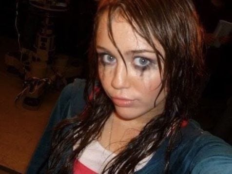 This may contain: a woman with blue eyes and long hair This may contain: a woman with blue eyes and long hair