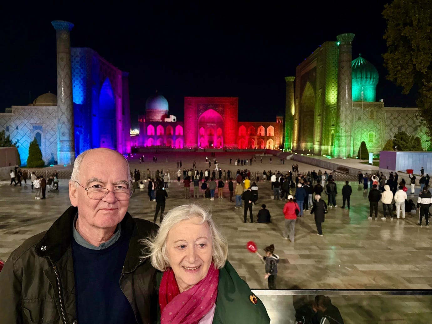 A person and person posing for a picture in front of a large building

AI-generated content may be incorrect.