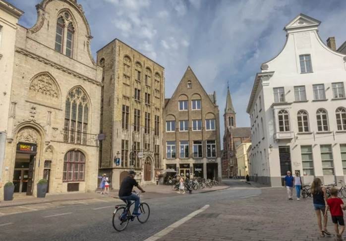 A person riding a bicycle in a street with buildings
AI-generated content may be incorrect. A person riding a bicycle in a street with buildings
AI-generated content may be incorrect.