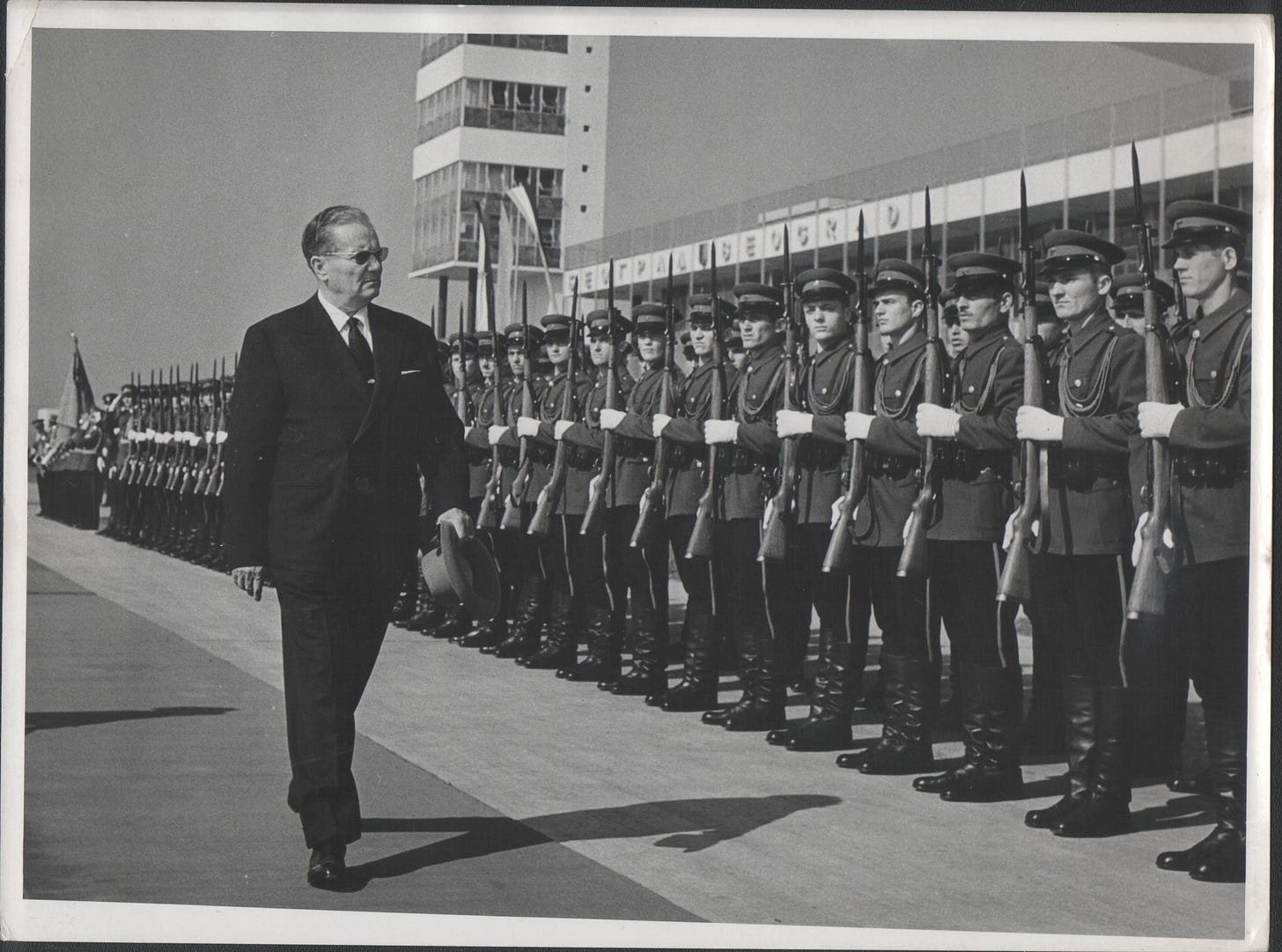 Yugoslavian President Josip Broz Tito, a prominent communist leader, reviewing guard units at the Belgrade airport in 1961.