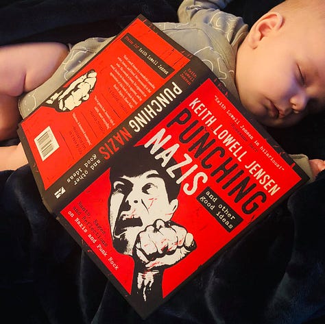 My book laying open atop a sleeping baby, my book next to a cute dog, and me reading me book at a bookstore event
