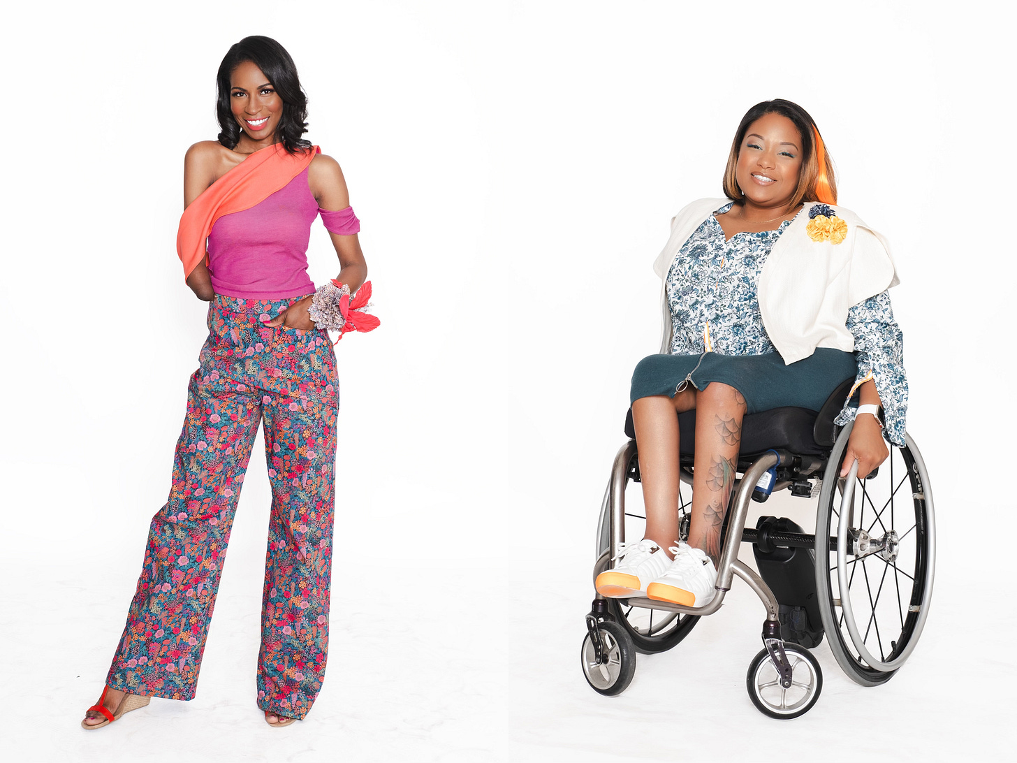 Two solo fashion portraits against a white background. The model on the left stands gracefully, wearing a pink top and vibrant, wide-leg floral trousers. The model on the right, seated in a wheelchair, has a warm, gentle smile and wears a patterned blouse under a stylish cream-colored vest.